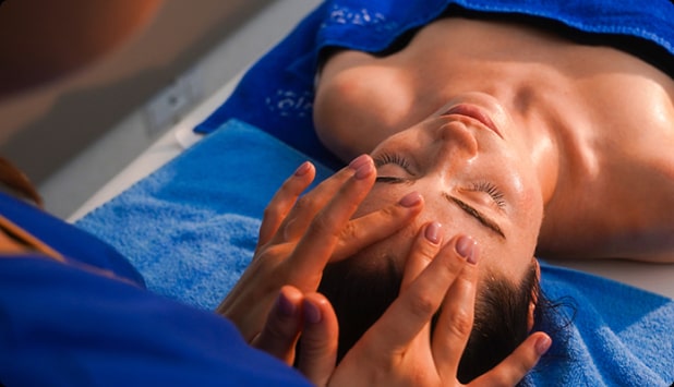 Luxurious facial massage treatment for a woman at the spa