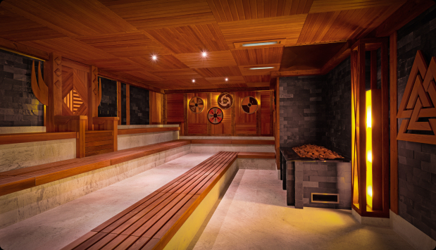 Cozy sauna room with wooden walls and benches